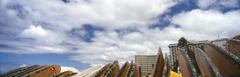 Framed Low angle view of skyscrapers and surfboards, Honolulu, Oahu, Hawaii, USA Print