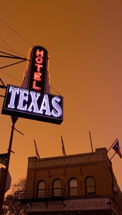 Framed Low angle view of a neon sign of a hotel lit up at dusk, Fort Worth Stockyards, Fort Worth, Texas, USA Print