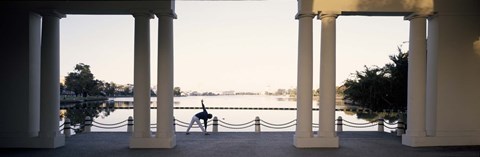 Framed Person stretching near colonnade, Lake Merritt, Oakland, Alameda County, California, USA Print
