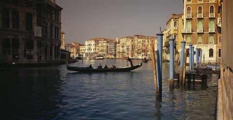 Framed Tourists sitting in a gondola, Grand Canal, Venice, Italy Print