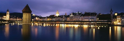 Framed Buildings lit up at dusk, Chapel Bridge, Reuss River, Lucerne, Switzerland Print
