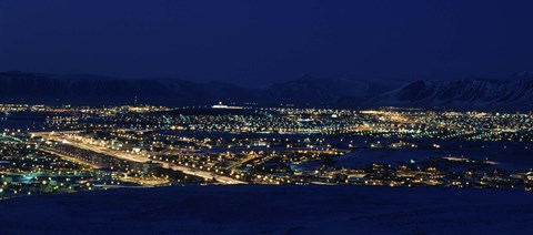 Framed High angle view of city lit up at night, Reykjavik, Iceland Print