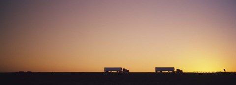 Framed Silhouette of two trucks moving on a highway, Interstate 5, California, USA Print