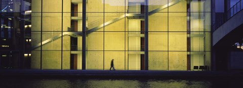 Framed Silhouette of a person walking in front of a building, Paul Lobe Haus, Berlin, Germany Print