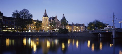 Framed Reflection of a railway station in water, Amsterdam Central Station, Amsterdam, Netherlands Print