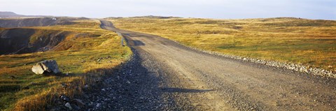 Framed Gravel road passing through a landscape, Cape Bonavista, Newfoundland, Newfoundland and Labrador, Canada Print