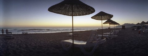 Framed Beach chairs and straw sun umbrellas on Patara Beach on the Mediterranean Sea at sunset, Patara, Antalya Province, Turkey Print