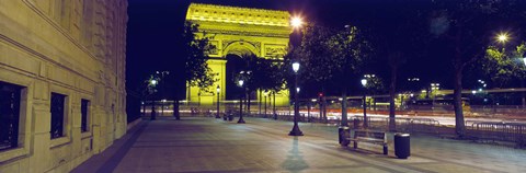 France, Paris, Arc de Triomphe lit up at night by Panoramic Images