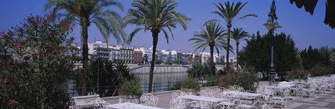 Framed Sidewalk cafe at the riverside, Guadalquivir River, Seville, Spain Print