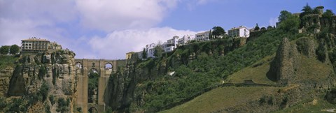 Framed Low angle view of a town, Tajo Bridge, Rio Guadalevin Gorge, Serrania De Ronda, Ronda, Andalusia, Spain Print