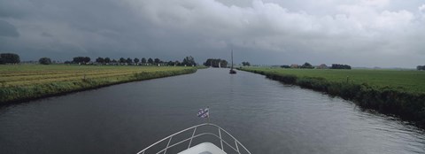 Framed Motorboat in a canal, Friesland, Netherlands Print