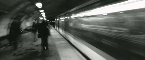 Framed Subway train passing through a subway station, London, England Print
