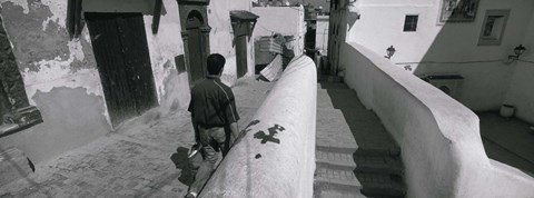 Framed Rear view of a man walking in front of a building, Casaba, Algiers, Algeria Print