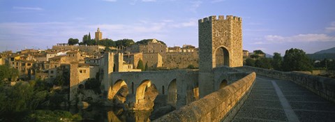 Framed Footbridge across a river in front of a city, Besalu, Catalonia, Spain Print