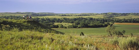 Framed Three mountain bikers on a hill, Kansas, USA Print