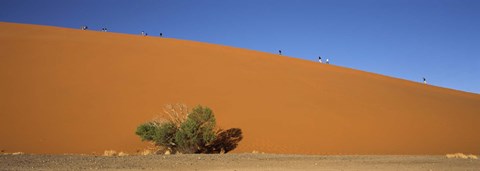 Framed Tourists climbing up a sand dune, Dune 45, Sossusvlei, Namib Desert, Namibia Print