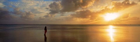 Framed Woman standing on sandbar looking at sunset, Aitutaki, Cook Islands Print