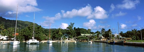 Framed Yachts and small fishing boats at the harbor on La Digue Island, Seychelles Print
