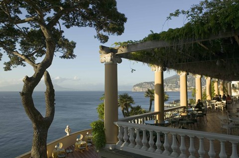 Framed Group of people sitting in a restaurant by the sea, Imperial Tramontano, Sorrento, Naples, Campania, Italy Print