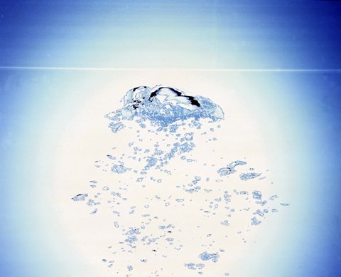 Framed Churning bubbles rising upwards with bright light background Print