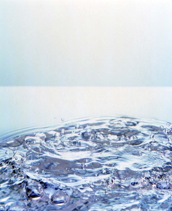 Framed Churning water bubbles in bright light Print