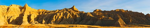 Framed Rock formations on a landscape in golden light, Saddle Pass Trail, Badlands National Park, South Dakota, USA Print