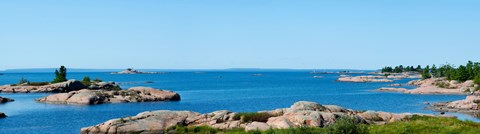 Framed Rock formations in a lake, Killarney, Georgian Bay, Ontario, Canada Print