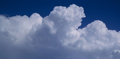Framed Cumulus Clouds Against a Dark Sky Print