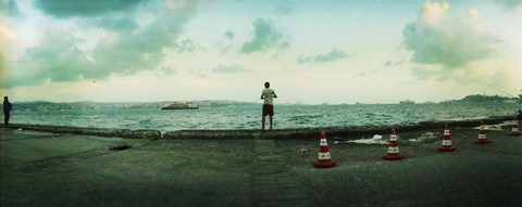 Framed Boy looking out on the Bosphorus Strait, Istanbul, Turkey Print