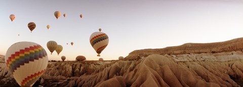 Framed Hot air balloons crossing a plateau, Cappadocia, Central Anatolia Region, Turkey Print