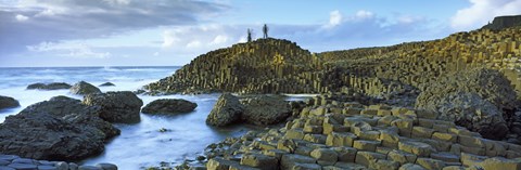 Framed People climbing on rocks at Giant&#39;s Causeway, Bushmills, County Antrim, Northern Ireland Print