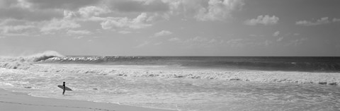 Framed Surfer standing on the beach in black and white, Oahu, Hawaii Print