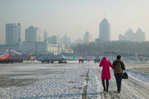Framed Couple walking on a frozen river, Songhua River, Harbin, Heilungkiang Province, China Print