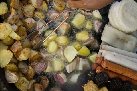 Framed Fried potatoes and snacks on the grill in a street market, Old Town, Lijiang, Yunnan Province, China Print