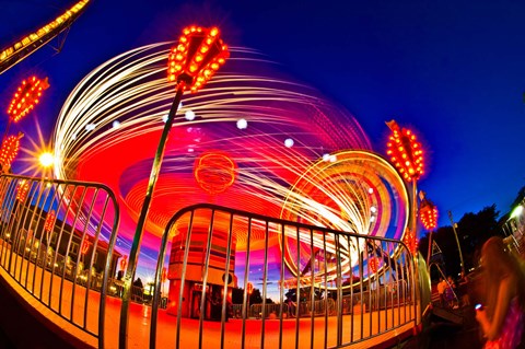 Framed Time exposure of a Carnival ride at night Print