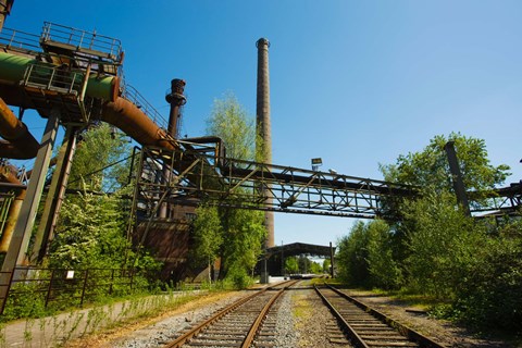 Framed Railroad tracks passing through an old steel mill, North Duisburg Landscape Park, Ruhr, North Rhine Westphalia, Germany Print