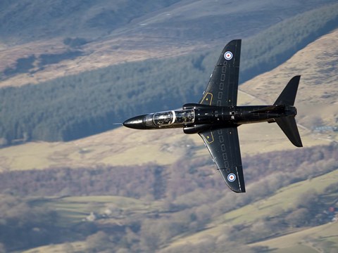 Framed Hawk T1 trainer aircraft of the Royal Air Force low flying over North Wales Print