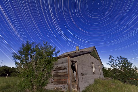 Framed Circumpolar star trails above an old farmhouse in Alberta, Canada Print