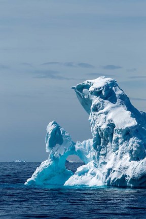 Framed arched iceberg floating in Gerlache Strait, Antarctica. Print