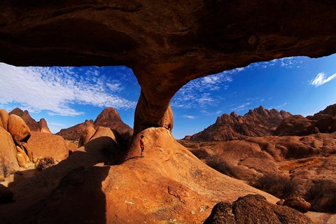 Framed Boy under natural rock arch at Spitzkoppe, Namibia Print