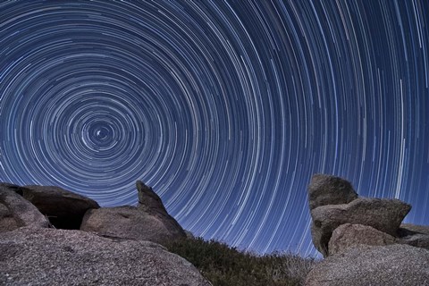 Framed boulder outcropping and star trails in Anza Borrego Desert State Park, California Print