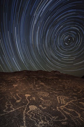Framed Star trails at an ancient petroglyph site near Bishop, California Print