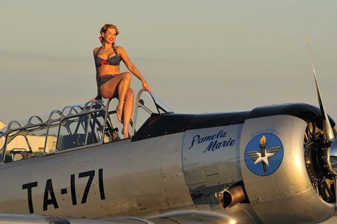 Framed 1940&#39;s style pin-up girl sitting on the cockpit of a World War II T-6 Texan Print