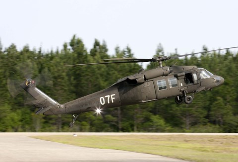 Framed US Army UH-60L Blackhawk helicopter landing at Florida Airport Print