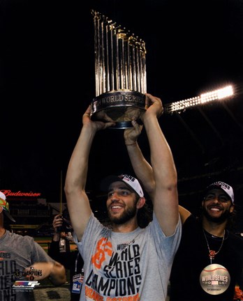Framed Madison Bumgarner with the World Series Championship Trophy Game 7 of the 2014 World Series Print
