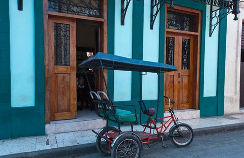 Framed Cuba, Camaquey, bike carriage and buildings Print
