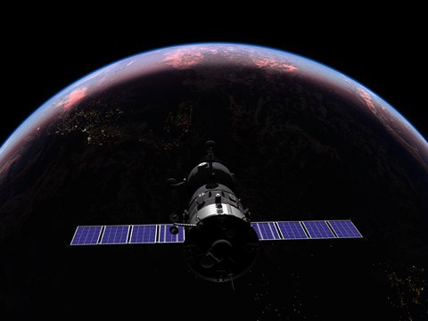 Framed Soyuz TMA-M spacecraft soars over the Atlantic Ocean at sunset Print