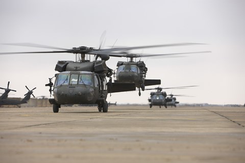 Framed UH-60 Black Hawks taxis out for a mission over northern Iraq Print