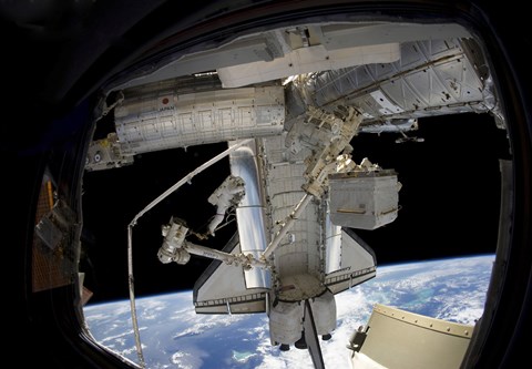 Framed Astronaut Participates in a Spacewalk while Anchored to a Foot Restraint Print
