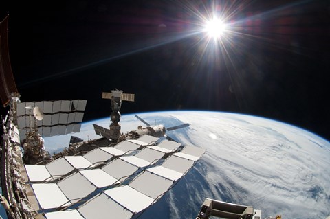 Framed Bright Sun, a Portion of the International Space Station and Earth&#39;s horizon Print